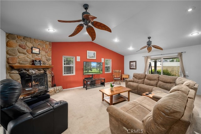 802 Duval St, La Verne, CA 91750 - carpeted living room with a ceiling fan, vaulted ceiling, recessed lighting, a stone fireplace, and baseboards