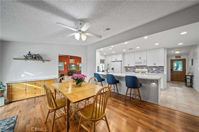 802 Duval St, La Verne, CA 91750 - dining area with ceiling fan, light wood finished floors, a textured ceiling, and recessed lighting