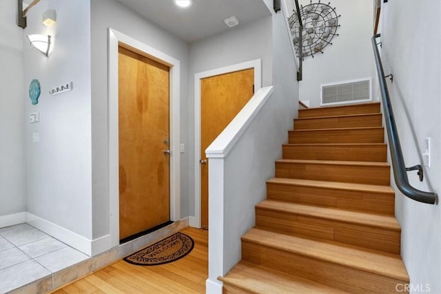 223 San Miguel St, Avila Beach, CA 93424 - stairway featuring wood finished floors and baseboards