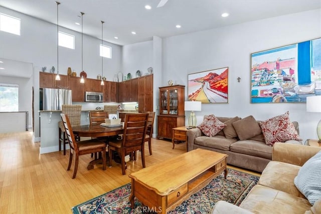 223 San Miguel St, Avila Beach, CA 93424 - living area featuring a towering ceiling, light wood-type flooring, recessed lighting, and baseboards