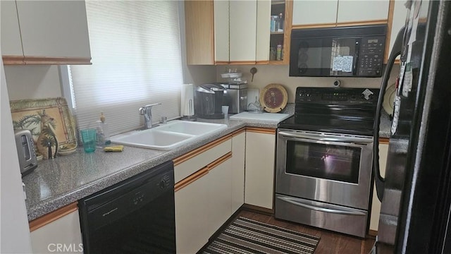 22907 Nadine Cir Unit B, Torrance, CA 90505 - kitchen with black appliances, a sink, white cabinetry, and glass insert cabinets