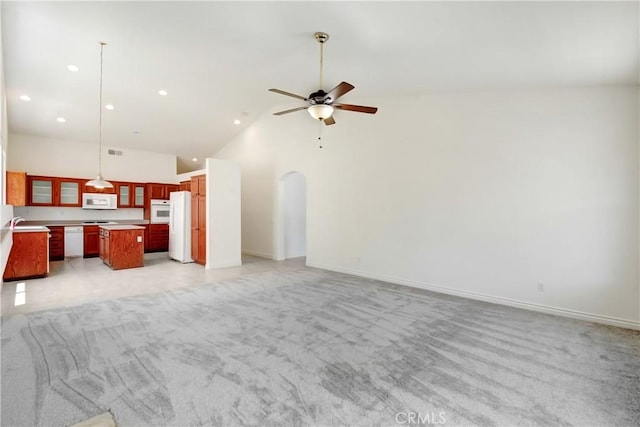 39654 Bordeaux Pl, Murrieta, CA 92562 - unfurnished living room with ceiling fan, light carpet, arched walkways, a sink, and recessed lighting