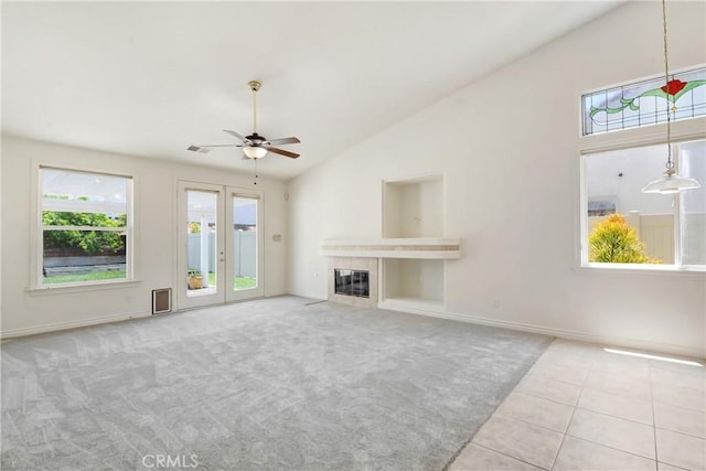 39654 Bordeaux Pl, Murrieta, CA 92562 - unfurnished living room with a ceiling fan, a fireplace, carpet, lofted ceiling, and baseboards