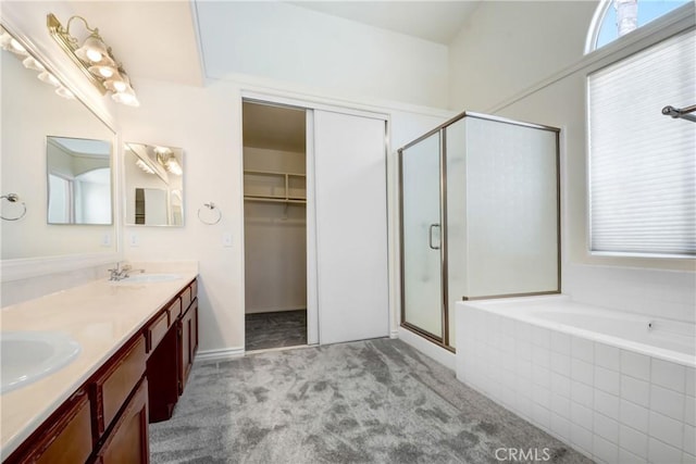 39654 Bordeaux Pl, Murrieta, CA 92562 - full bathroom with a stall shower, double vanity, a garden tub, and a spacious closet