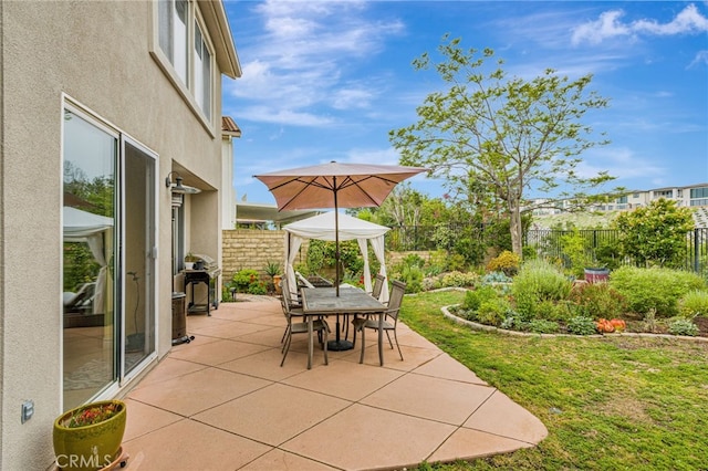 11771 Coorsgold Ln, Porter Ranch, CA 91326 - fenced backyard with a patio area, outdoor dining space, and a grill