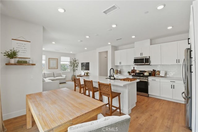 3590 E Peckham Paseo Unit 6, Ontario, CA 91761 - dining room featuring light wood-style flooring and recessed lighting