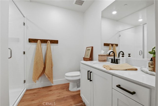 3590 E Peckham Paseo Unit 6, Ontario, CA 91761 - full bathroom featuring vanity, wood finished floors, a stall shower, and recessed lighting