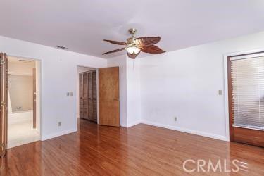 965 Morro Ave Unit D, Morro Bay, CA 93442 - unfurnished room featuring a ceiling fan, wood finished floors, and baseboards
