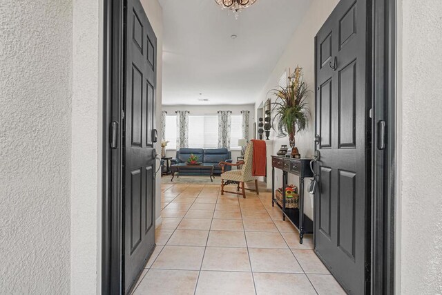 8749 Fairoaks Ct, Rancho Cucamonga, CA 91730 - foyer featuring light tile patterned floors and a textured wall