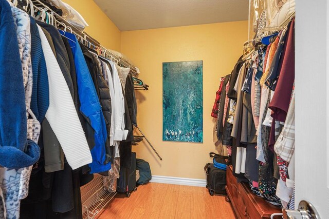 8749 Fairoaks Ct, Rancho Cucamonga, CA 91730 - spacious closet with wood finished floors