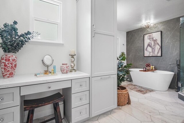 8749 Fairoaks Ct, Rancho Cucamonga, CA 91730 - bathroom with tile walls, a freestanding bath, and vanity
