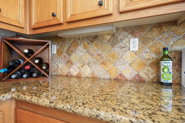 8749 Fairoaks Ct, Rancho Cucamonga, CA 91730 - kitchen view of decorative backsplash and light stone countertops