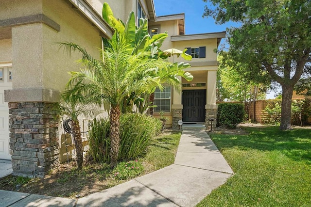 8749 Fairoaks Ct, Rancho Cucamonga, CA 91730 - view of exterior entry featuring stucco siding and stone siding