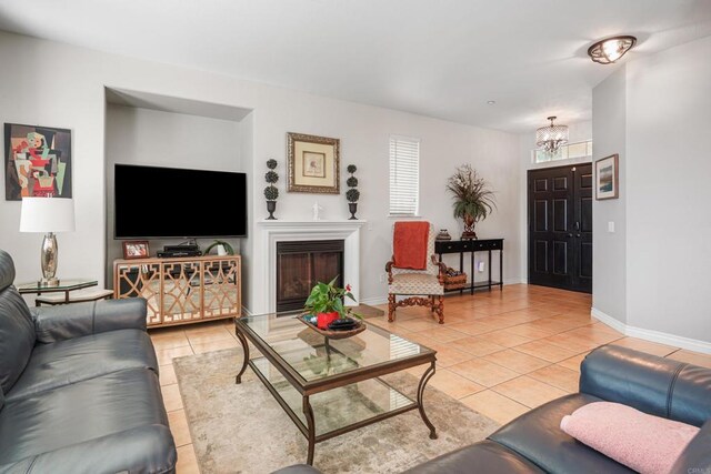 8749 Fairoaks Ct, Rancho Cucamonga, CA 91730 - living room featuring light tile patterned floors, a chandelier, and baseboards