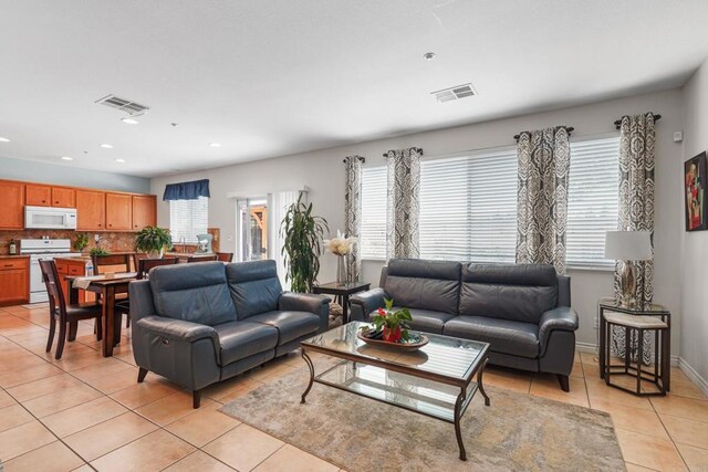 8749 Fairoaks Ct, Rancho Cucamonga, CA 91730 - living room featuring light tile patterned floors, recessed lighting, and baseboards