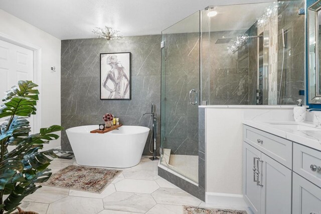 8749 Fairoaks Ct, Rancho Cucamonga, CA 91730 - bathroom with a shower stall, vanity, a freestanding bath, and tile walls