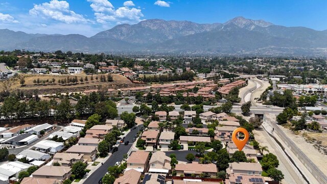 8749 Fairoaks Ct, Rancho Cucamonga, CA 91730 - aerial view of property and surrounding area featuring a mountain backdrop and nearby suburban area