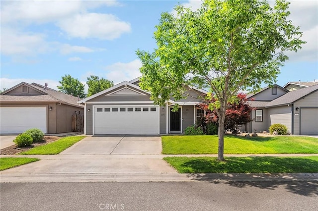 1377 Lucy Way, Chico, CA 95973 - ranch-style house with a front yard, concrete driveway, and an attached garage