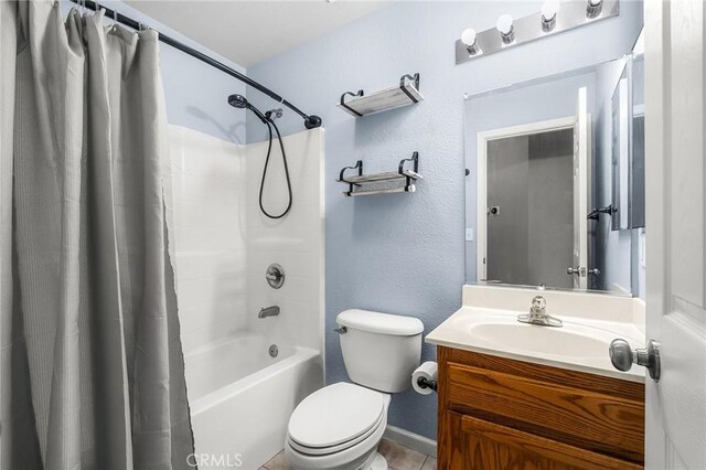 1377 Lucy Way, Chico, CA 95973 - bathroom with vanity, shower / bathtub combination with curtain, toilet, baseboards, and tile patterned floors