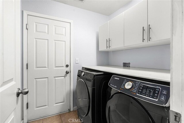1377 Lucy Way, Chico, CA 95973 - washroom featuring cabinet space, washing machine and clothes dryer, and light tile patterned floors