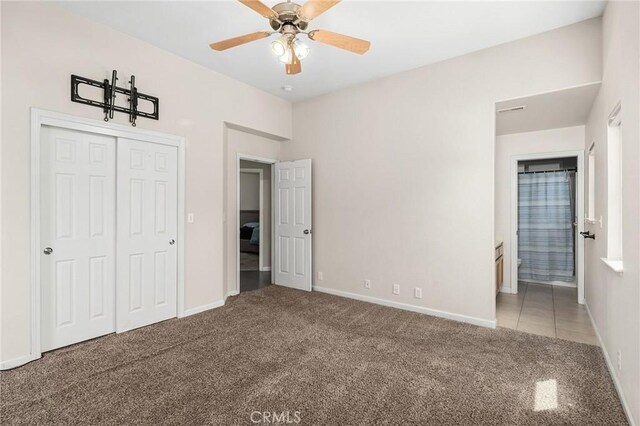1377 Lucy Way, Chico, CA 95973 - unfurnished bedroom with carpet flooring, a closet, baseboards, connected bathroom, and a ceiling fan