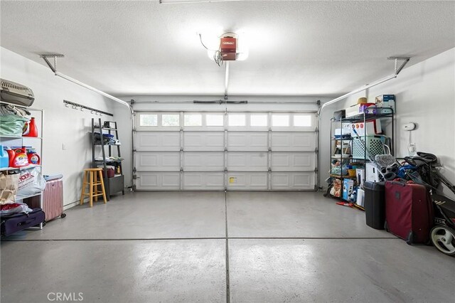 1377 Lucy Way, Chico, CA 95973 - garage featuring a garage door opener