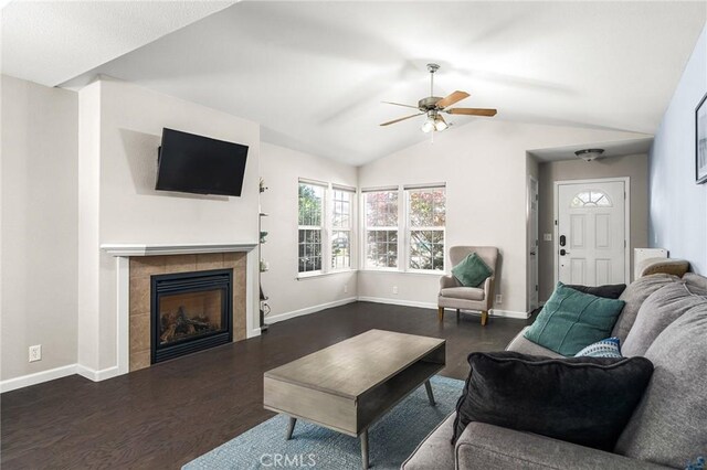 1377 Lucy Way, Chico, CA 95973 - living area with dark wood finished floors, a ceiling fan, a fireplace, vaulted ceiling, and baseboards