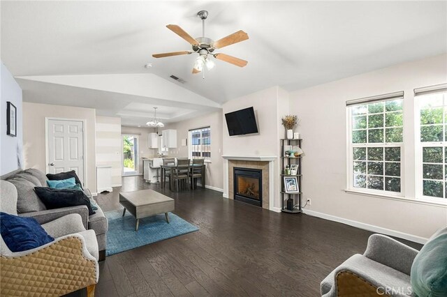 1377 Lucy Way, Chico, CA 95973 - living room featuring dark wood-type flooring, a ceiling fan, vaulted ceiling, baseboards, and a tiled fireplace