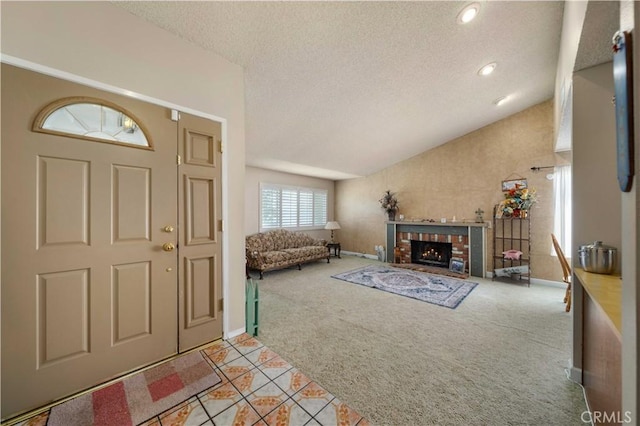 1344 River Rd, Corona, CA 92878 - entryway featuring light carpet, light tile patterned flooring, a fireplace, baseboards, and a textured ceiling