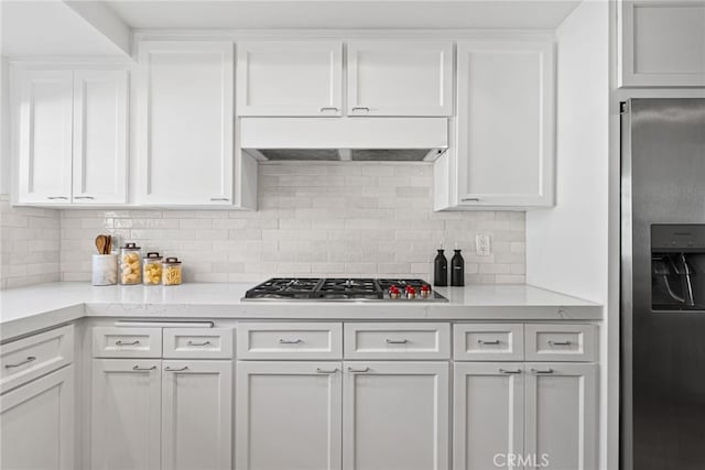 431 Cranston Ct Unit 102, Long Beach, CA 90803 - kitchen featuring appliances with stainless steel finishes, under cabinet range hood, white cabinets, and backsplash