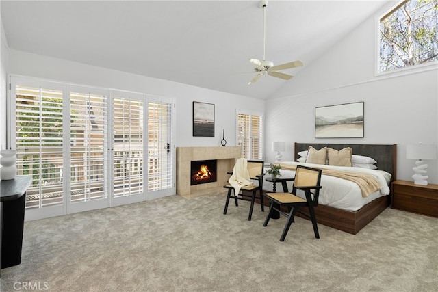 431 Cranston Ct Unit 102, Long Beach, CA 90803 - bedroom with carpet flooring, a tiled fireplace, access to outside, high vaulted ceiling, and a ceiling fan