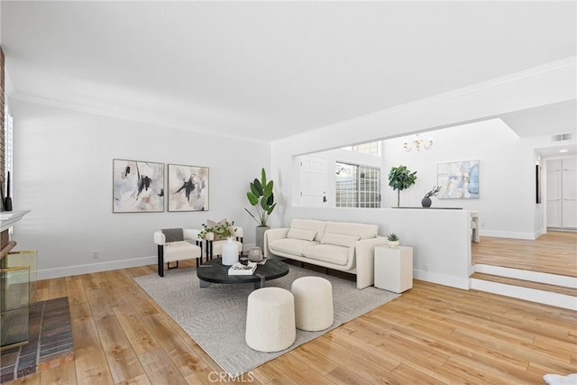 431 Cranston Ct Unit 102, Long Beach, CA 90803 - living room featuring a chandelier, hardwood / wood-style floors, and ornamental molding