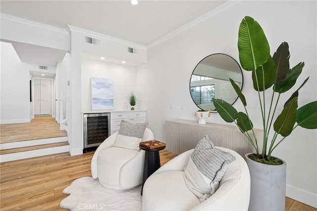 431 Cranston Ct Unit 102, Long Beach, CA 90803 - sitting room featuring wine cooler, crown molding, light wood-style floors, and recessed lighting