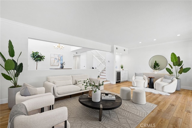 431 Cranston Ct Unit 102, Long Beach, CA 90803 - living area with wine cooler, stairs, crown molding, wood finished floors, and a chandelier