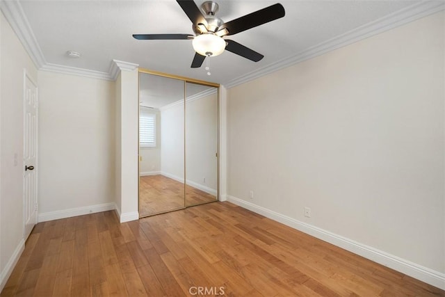 27692 Motherlode Ct, Laguna Niguel, CA 92677 - unfurnished bedroom with light wood-type flooring, ornamental molding, a closet, and a ceiling fan