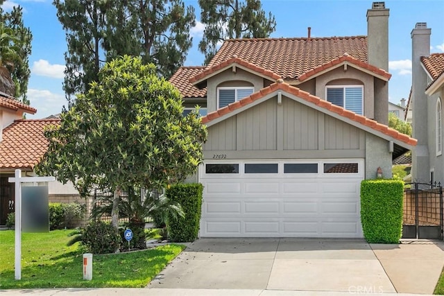 27692 Motherlode Ct, Laguna Niguel, CA 92677 - view of front of house featuring a tiled roof, driveway, and an attached garage