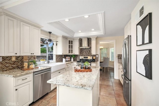 27692 Motherlode Ct, Laguna Niguel, CA 92677 - kitchen with stainless steel appliances, wall chimney exhaust hood, plenty of natural light, a raised ceiling, and recessed lighting