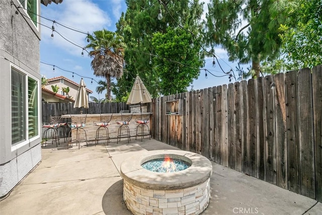 27692 Motherlode Ct, Laguna Niguel, CA 92677 - fenced backyard featuring an outdoor fire pit and a patio area