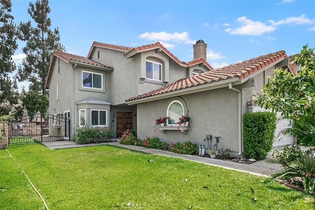 27692 Motherlode Ct, Laguna Niguel, CA 92677 - mediterranean / spanish-style home with a chimney, a gate, stucco siding, and a tile roof