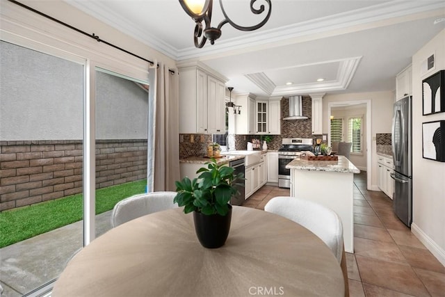 27692 Motherlode Ct, Laguna Niguel, CA 92677 - dining space featuring light tile patterned flooring, crown molding, recessed lighting, and a tray ceiling