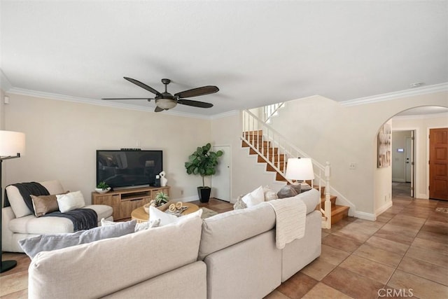 27692 Motherlode Ct, Laguna Niguel, CA 92677 - living area with arched walkways, ornamental molding, stairs, a ceiling fan, and light tile patterned floors