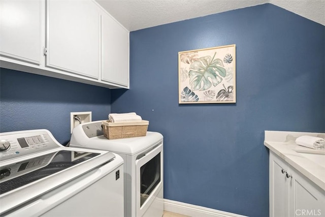 27692 Motherlode Ct, Laguna Niguel, CA 92677 - laundry area featuring washer and dryer, cabinet space, and a textured ceiling