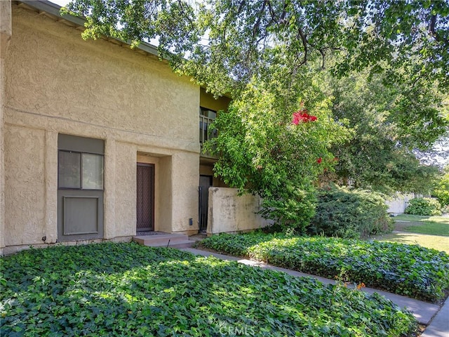 20807 Roscoe Blvd Unit 5, Winnetka, CA 91306 - doorway to property featuring stucco siding