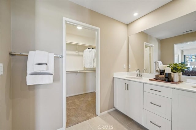 16183 Lumia Way, Fontana, CA 92336 - full bathroom featuring double vanity, a spacious closet, recessed lighting, tile patterned flooring, and baseboards