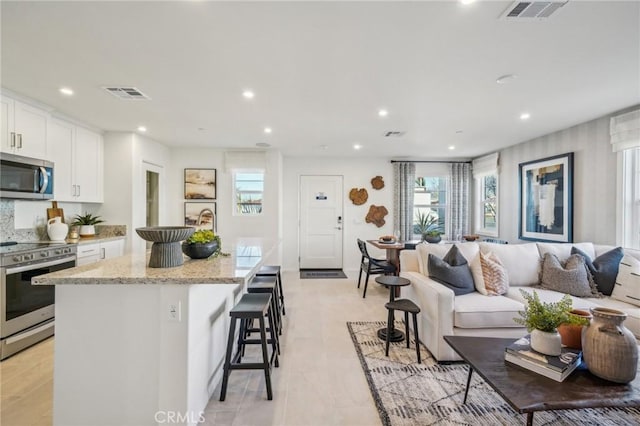 16183 Lumia Way, Fontana, CA 92336 - living area with recessed lighting and healthy amount of natural light