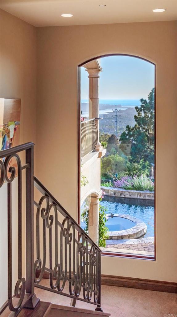 7133 Obelisco Cir, Carlsbad, CA 92009 - stairway featuring arched walkways and baseboards