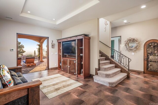7133 Obelisco Cir, Carlsbad, CA 92009 - living area with recessed lighting, stairway, baseboards, and a raised ceiling
