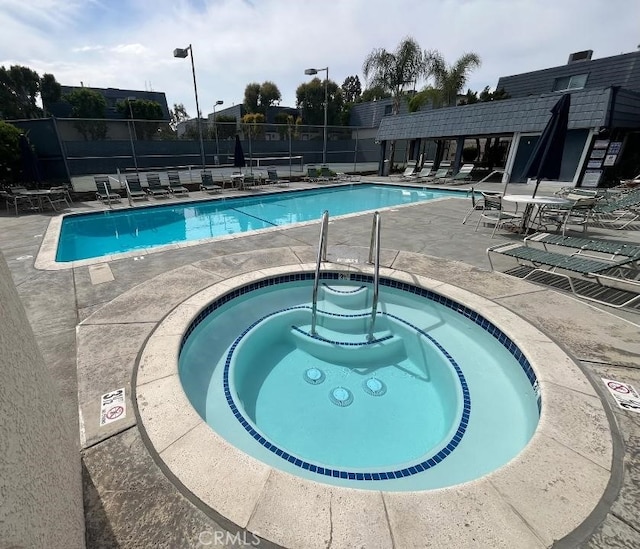 18550 Hatteras St Unit 7, Tarzana, CA 91356 - community pool with a patio area and a community hot tub