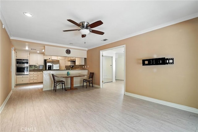 19401 Twin Hills Pl, Porter Ranch, CA 91326 - kitchen featuring appliances with stainless steel finishes, dark countertops, a ceiling fan, crown molding, and a kitchen bar