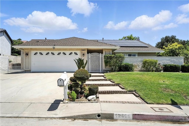 19401 Twin Hills Pl, Porter Ranch, CA 91326 - single story home featuring roof mounted solar panels, driveway, a garage, and a gate